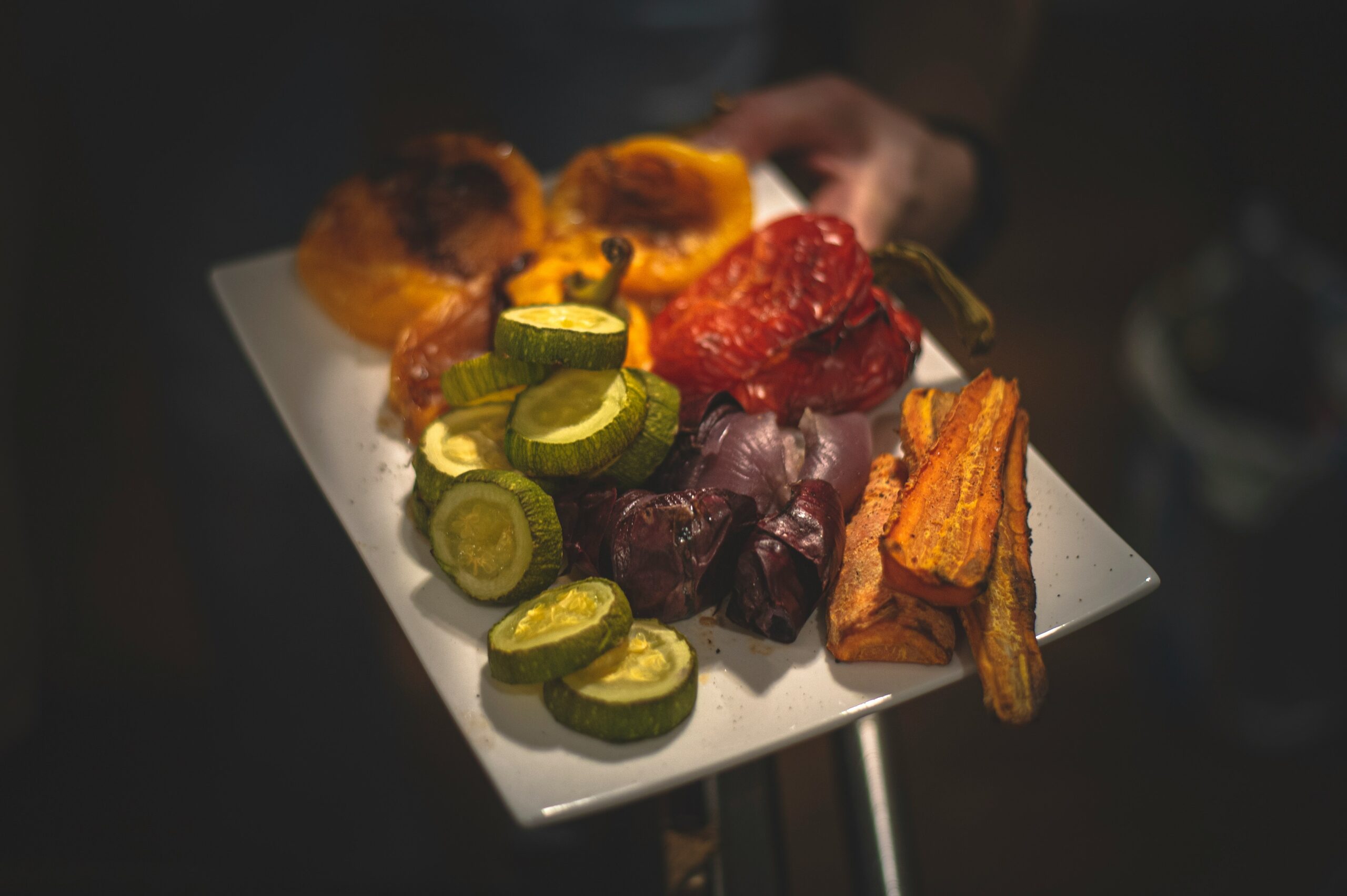 sliced fruits on white ceramic plate